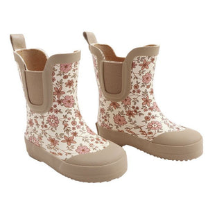 The Quincy Mae Girls' Rain Boots feature a floral pattern in pink and brown, beige soles and trim, and a comfortable rubber lining.
