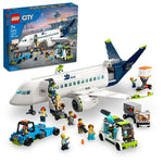 The LEGO® City Passenger Airplane set from Legos - Toyhouse (LEGO 60367) features a sleek white and blue aircraft, ground vehicles, various airport accessories, and mini-figures, all showcased with the eye-catching packaging prominently displayed in the background.