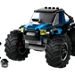 The LEGO® City Blue Monster Truck from Legos - Toyhouse, featuring large wheels, is shown next to a minifigure and helmet for an exciting off-road toy scene.