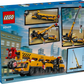 Back of a LEGO® City Yellow Mobile Construction Crane box by Legos - Toyhouse, featuring a realistic crane with images of its extending, rotating arm against a city backdrop—the ideal construction vehicle playset for aspiring builders.