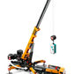 A realistic LEGO® City Yellow Mobile Construction Crane by Legos - Toyhouse features yellow and black colors, an extended boom with hook lifting a blue and white container, and deployed stabilizing legs for safety.