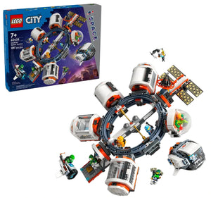 The LEGO® City Modular Space Station by Legos - Toyhouse features a circular station playset with modules, astronaut minifigures, and accessories; set box visible in the background.