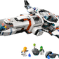 The Legos - Toyhouse LEGO® City Modular Galactic Spaceship set features a white ship with orange and blue accents, four astronaut minifigures in spacesuits, two small aliens, and space accessories for kids’ imaginative play.