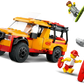 The LEGO® City Lifeguard Beach Rescue Truck by Legos - Toyhouse comes with 2 minifigures, a surfboard, rescue buoy, and shark—ideal for creative lifeguard fun at the beach.