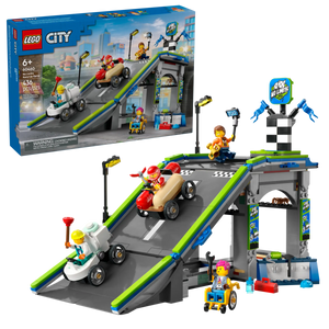 The LEGO® City No Limits: Race Car Ramp Track by Legos - Toyhouse includes a racetrack ramp, three race cars, four minifigures, and accessories—an exciting soapbox race car kit shown assembled with its box in the background.