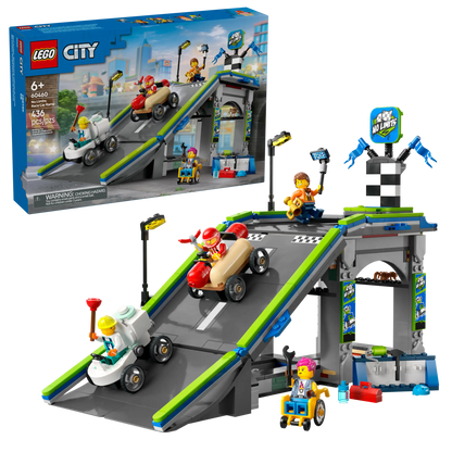 The LEGO® City No Limits: Race Car Ramp Track by Legos - Toyhouse includes a racetrack ramp, three race cars, four minifigures, and accessories—an exciting soapbox race car kit shown assembled with its box in the background.