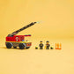 The LEGO® City Fire Ladder Truck by Legos - Toyhouse includes a fire truck with extendable hose, 2 firefighter minifigures, helmets, and LEGO flames, shown on a plain yellow background.