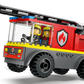 The LEGO® City Fire Ladder Truck by Legos - Toyhouse includes two firefighter mini-figures and features a red and gray design, ladder on top, and flame emblem—ideal for fire truck toy collections.