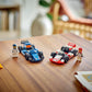 The LEGO® City F1® Williams Racing & Haas F1® Race Cars by Legos - Toyhouse, featuring blue and red/white cars with matching driver minifigures, are displayed on a wooden table.