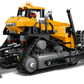 The Legos - Toyhouse LEGO® City Yellow Bulldozer set includes a yellow bulldozer with black treads, two construction worker minifigures, a walkie-talkie, and bricks for creative construction vehicle play.