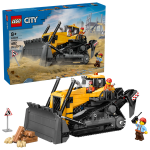 The LEGO® City Yellow Bulldozer by Legos - Toyhouse includes 682 pieces, a large yellow and black construction vehicle playset, two construction worker minifigures, and accessories. Box is visible in the background.