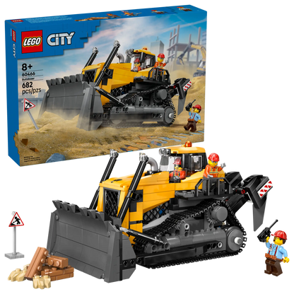 The LEGO® City Yellow Bulldozer by Legos - Toyhouse includes 682 pieces, a large yellow and black construction vehicle playset, two construction worker minifigures, and accessories. Box is visible in the background.