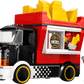 Create your own street food scene with the LEGO® City Fries Food Truck by Legos - Toyhouse, featuring a large fries sculpture plus two minifigures—one serving fries from the window and another holding a gray accessory.