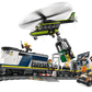 The LEGO® City Police Train Heist by Legos - Toyhouse features an electric train, helicopter with a jail cell, action minifigures, a car on the tracks, and fun accessories for thrilling play.