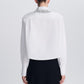 Back view of a white cotton poplin Renata Embellished Collar Cropped Shirt with long sleeves and metallic fringe embellishment on the back of the collar.