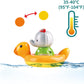 During bath time, a Hape Spin Splash & Swim Elephant Color-Changing Bath Toy floats in the water with a thermometer.