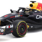 The Maisto R/C 1:24 Oracle Red Bull Racing RB19 (2023) remote controlled car, styled in striking black and red with prominent sponsor logos such as Oracle, Honda, and Mobil, is displayed on a clean white background. Inspired by Max Verstappen’s official Formula 1 livery for the championship-winning Red Bull Racing team, this model captures authentic detailing from the 2023 season.