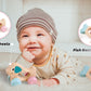A baby is laying on the floor with a Hape Multi-Stage Sensory Gift Set toy, engaging in developmental milestones.