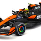 A front-side image of the Maisto R/C 1:24 McLaren MCL38 showcases its striking orange and black design, complete with authentic sponsor logos, aerodynamic details, and racing tires—making it the ideal choice for enthusiasts of Formula Racing and radio control vehicles.