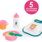 The Corolle Mealtime Set - Pink includes a sippy cup, baby bottle, bowl with spoon, and bib—5 accessories for pretend feeding fun. Perfect for fans of Corolle baby dolls.