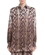 A person wearing the Stella McCartney Snake Print Satin Shirt.