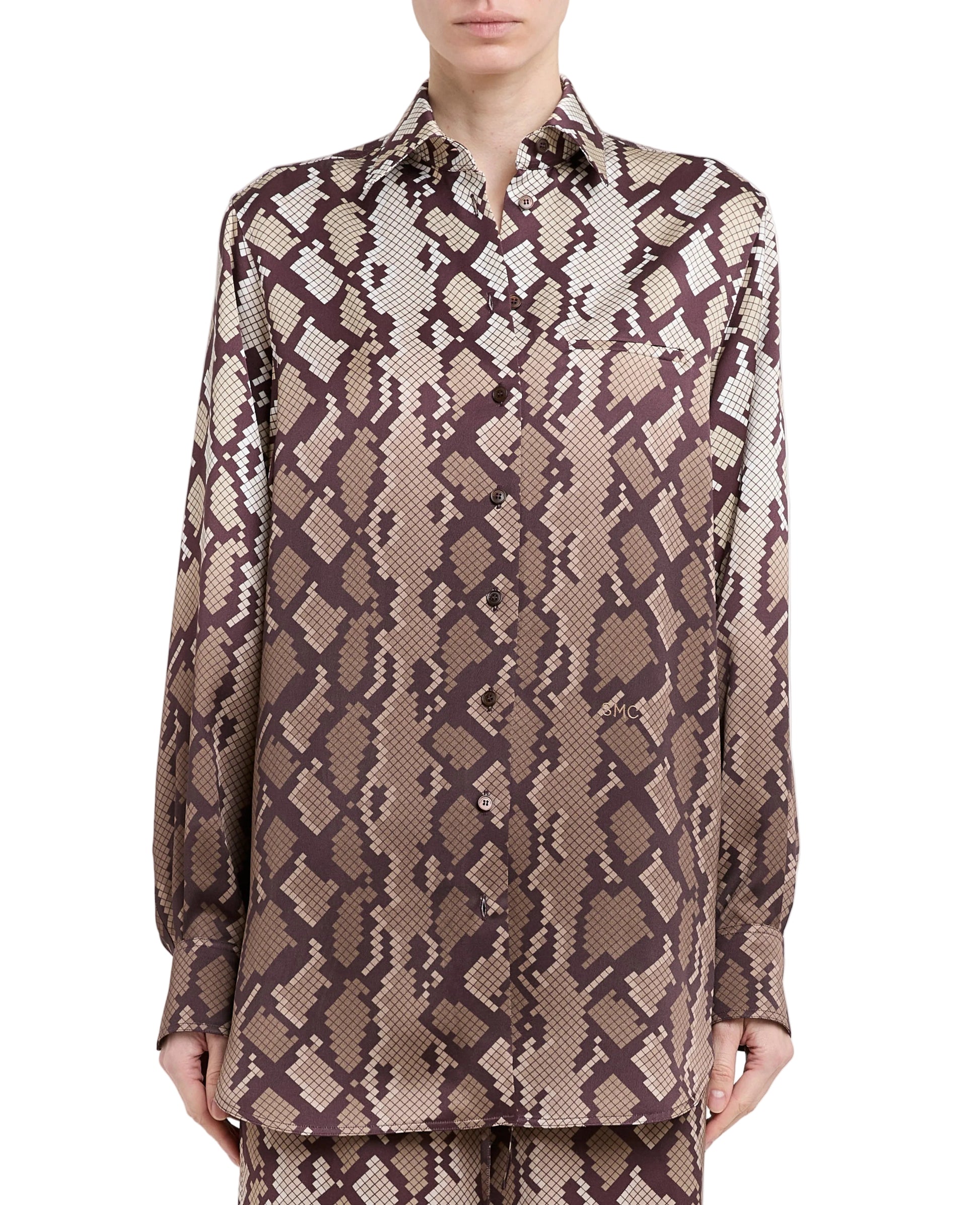 A person wearing the Stella McCartney Snake Print Satin Shirt.