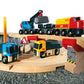 A wooden toy train set with construction vehicles and a railway bridge by Brio World. 