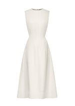 The TWP Crew Neck Dress is a sleeveless, white midi dress made from a viscose-linen blend, featuring a fitted bodice and flared skirt, shown on a plain background.