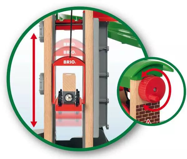 The BRIO Lift & Load Warehouse Set, by Brio, includes a toy crane mechanism as part of its intricate railway configuration. It showcases a red pulley system that skillfully lifts a small cart. A close-up reveals a gear wheel on the side designed for seamless operation, enhancing the playful engineering experience.