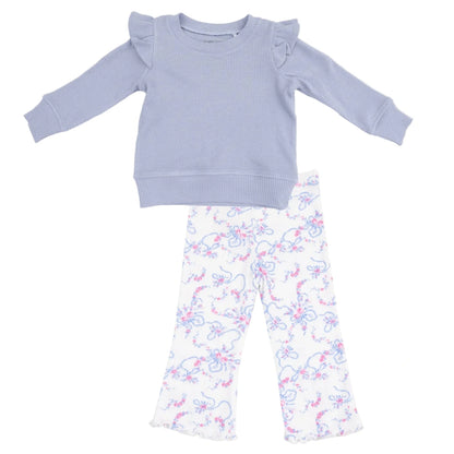 The Angel Dear Girls' Ruffle Shoulder Waffle Shirt in soft lavender pairs perfectly with matching ribbed flare pants, both featuring a charming pink and blue floral pattern.