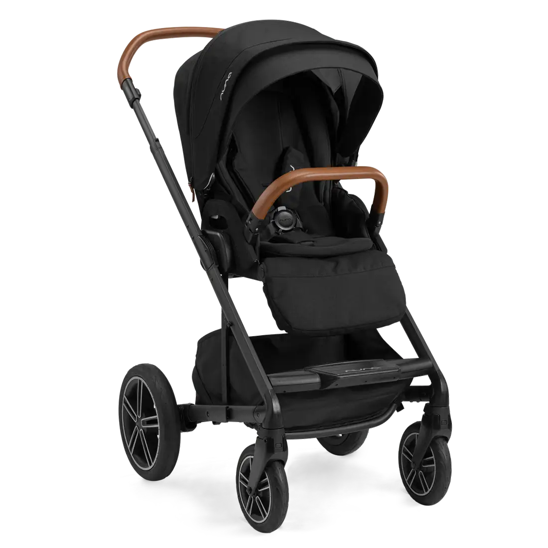 The Nuna MIXX Next Stroller in black, showcasing stylish brown handles and large wheels, is pictured from a three-quarter angle. Its compact folding design and MagneTech Secure Snap™ provide both elegance and practicality for every trip.