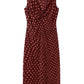 The Stella McCartney Polka Dot Mesh V-Neck Midi Dress is a sleeveless maroon dress adorned with pink polka dots, showcasing a twisted knot detail at the chest and a knee-length hem, expertly crafted from stretch polyamide for a flattering fit.