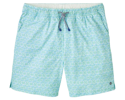 The Peter Millar Tide Lines Swim Trunk features a light blue and green pattern, elastic drawstring waistband, quick-drying fabric, side slits, mesh liner for comfort, and a small circular logo near the hem.
