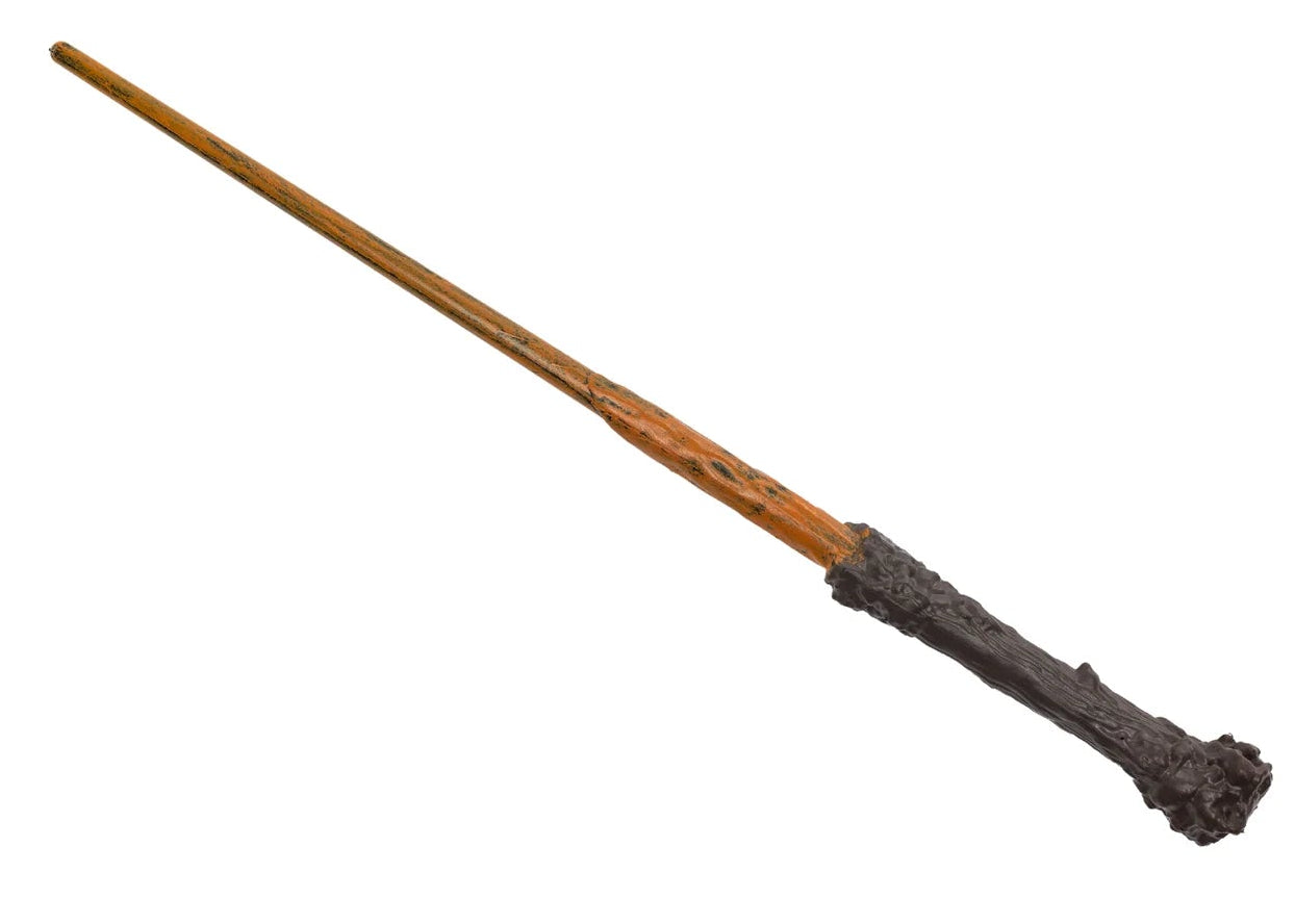 The Great Pretenders Wizard Wand features a dark, textured wooden handle and a smooth, light brown shaft, shown isolated on a white background.