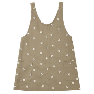 Rylee & Cru Girls’ V-Neck Overall Dress in khaki, detailed with adjustable straps, two front patch pockets, and an allover small white floral print.