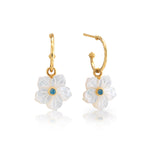 The Mermaid Garden Hoop Earrings with Flower Charm by Juliska Capucine De Wulf feature white carved petals and blue gemstone centers—a beautiful, modern take on mother of pearl earrings.