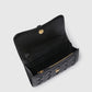 The Stella McCartney Stella Woven Ryder Wallet with Strap features a black quilted exterior, woven design, zippered pocket, card slots, and gold snap closure, combining style and functionality inspired by classic elegance.