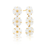 The Mermaid Garden Petite Linear Earrings by Juliska Capucine De Wulf feature three-layered gold and white mother of pearl flowers with gold centers and accents—perfect spring jewelry.