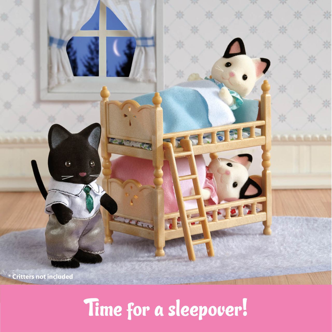 Two Calico Critters figures are cozily tucked into the Stack and Play Beds, each with a soft blanket, while a third cat in a shirt and tie stands close by. A window reveals the night sky, completing this charming dollhouse furniture scene from Calico Critters. The text below reads: “Time for a sleepover!”.