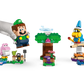 A hand holds a LEGO® Luigi™ figure above the LEGO® Super Mario™ Adventures set by Legos - Toyhouse, featuring characters, a tree, enemy, and flag—an ideal Nintendo gift for fans.