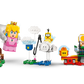A hand places the LEGO® Peach™ figure from the LEGO® Super Mario™ Adventures with Interactive LEGO® Peach™, by Legos - Toyhouse, among colorful Super Mario elements like a green pipe, characters, and a flagpole.