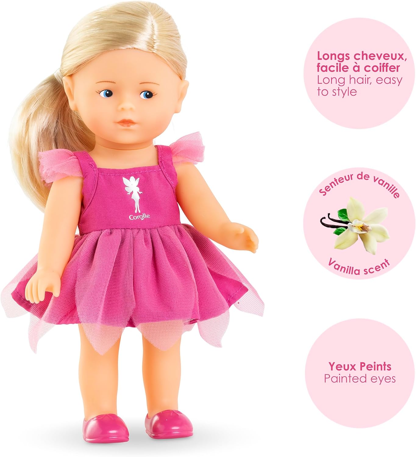 The Corolle Rosy Fairy Set includes a blonde doll in a pink dress and shoes, with butterfly wings, vanilla scent, and painted eyes. Three circular callouts highlight these magical features in French and English.