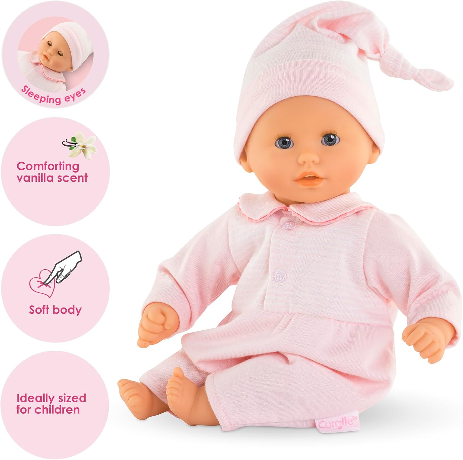 The Corolle Bebe Calin - Charming Pastel 12" is a soft-bodied baby doll in pink clothes and hat, featuring sleeping eyes, a vanilla scent, and an ideal size—perfect as a first doll for children.
