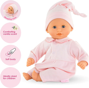 The Corolle Bebe Calin - Charming Pastel 12" is a soft-bodied baby doll in pink clothes and hat, featuring sleeping eyes, a vanilla scent, and an ideal size—perfect as a first doll for children.