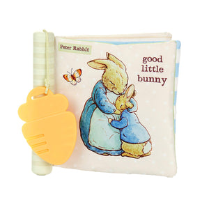The Kids Preferred Good Little Bunny Soft Book features two hugging rabbits, a butterfly, and an attached orange carrot-shaped sensory teether.