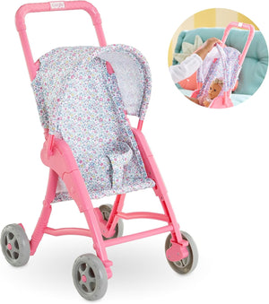 The Corolle Stroller - Flowered features a floral-patterned canopy, perfect for baby doll play. Inset shows a child placing a My First Corolle Doll inside the stroller.