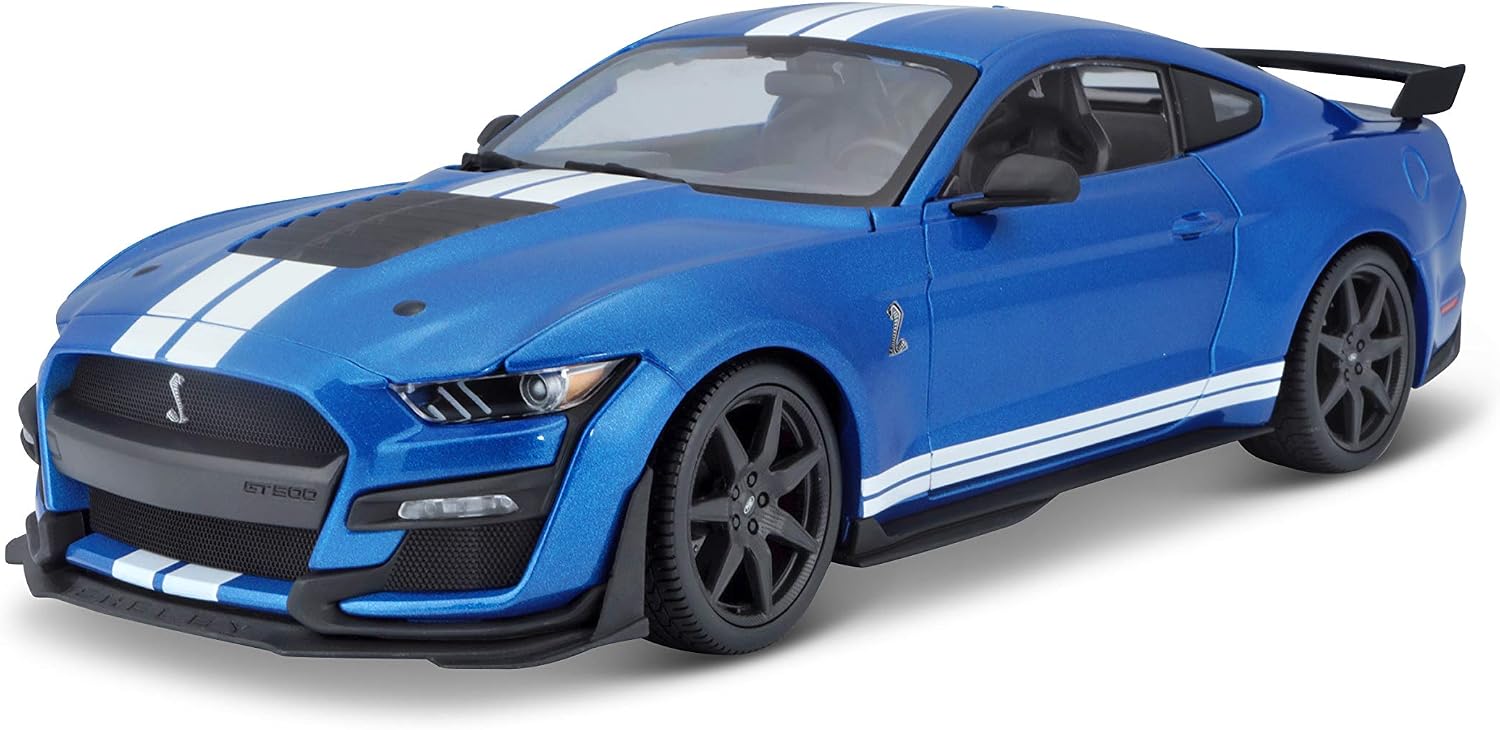 The 1:18 SE 2020 Mustang Shelby GT500 by Maisto is a striking die-cast model car featuring a blue finish with white racing stripes, black wheels, rear spoiler, and black hood vent—shown here from a front-side angle, it’s the perfect collectible for car enthusiasts.