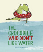 An illustrated crocodile in a red polka-dot swim ring stands by water. "Crocodile Who Didn't Like Water" by Gemma Merino (Simon & Schuster) encourages kids to embrace being themselves.