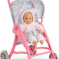 A Corolle My First Doll in a white bear suit sits in the Stroller - Flowered, featuring a floral canopy.
