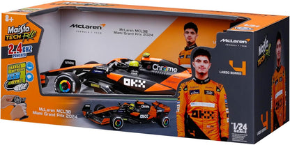 Box containing a 1:24 scale Maisto R/C McLaren MCL38—a thrilling radio control vehicle from Maisto—showcased in vibrant packaging featuring images of the actual car, driver Lando Norris, and highlights of the McLaren Team MCL38. Perfect for Formula Racing fans and collectors alike.